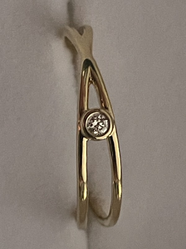 Bague croisé or jaune 18k diamant serti clos