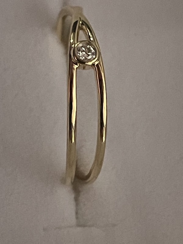 Bague croisé or jaune 18k diamant serti clos